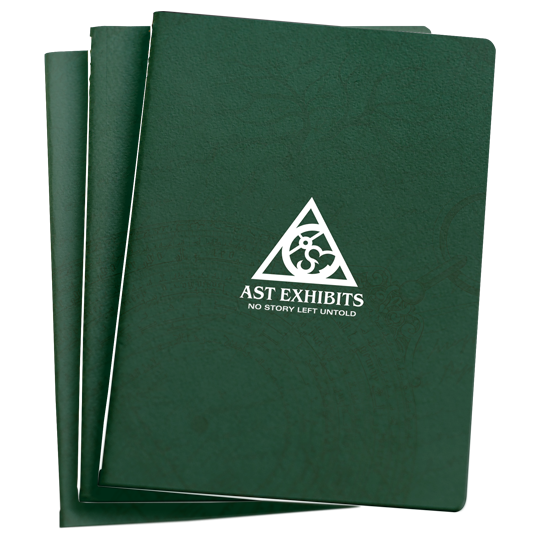 Product mockup of three saddle-stitched pocket-sized notebooks with emerald green covers and the AST Exhibits logo set in white