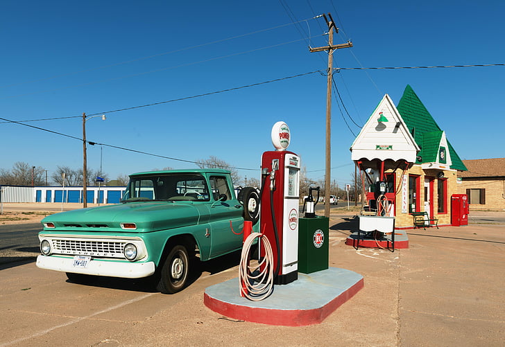 A royalty free image of vintage gasoline pumps at a classic service station