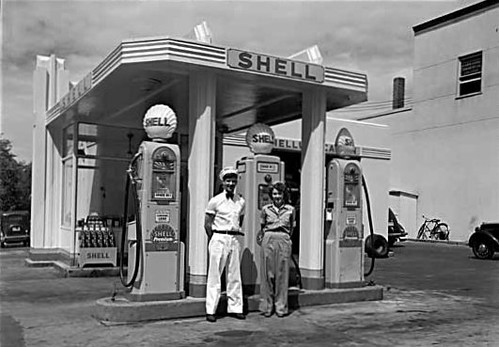 A royalty free image of vintage gasoline pumps at a classic service station